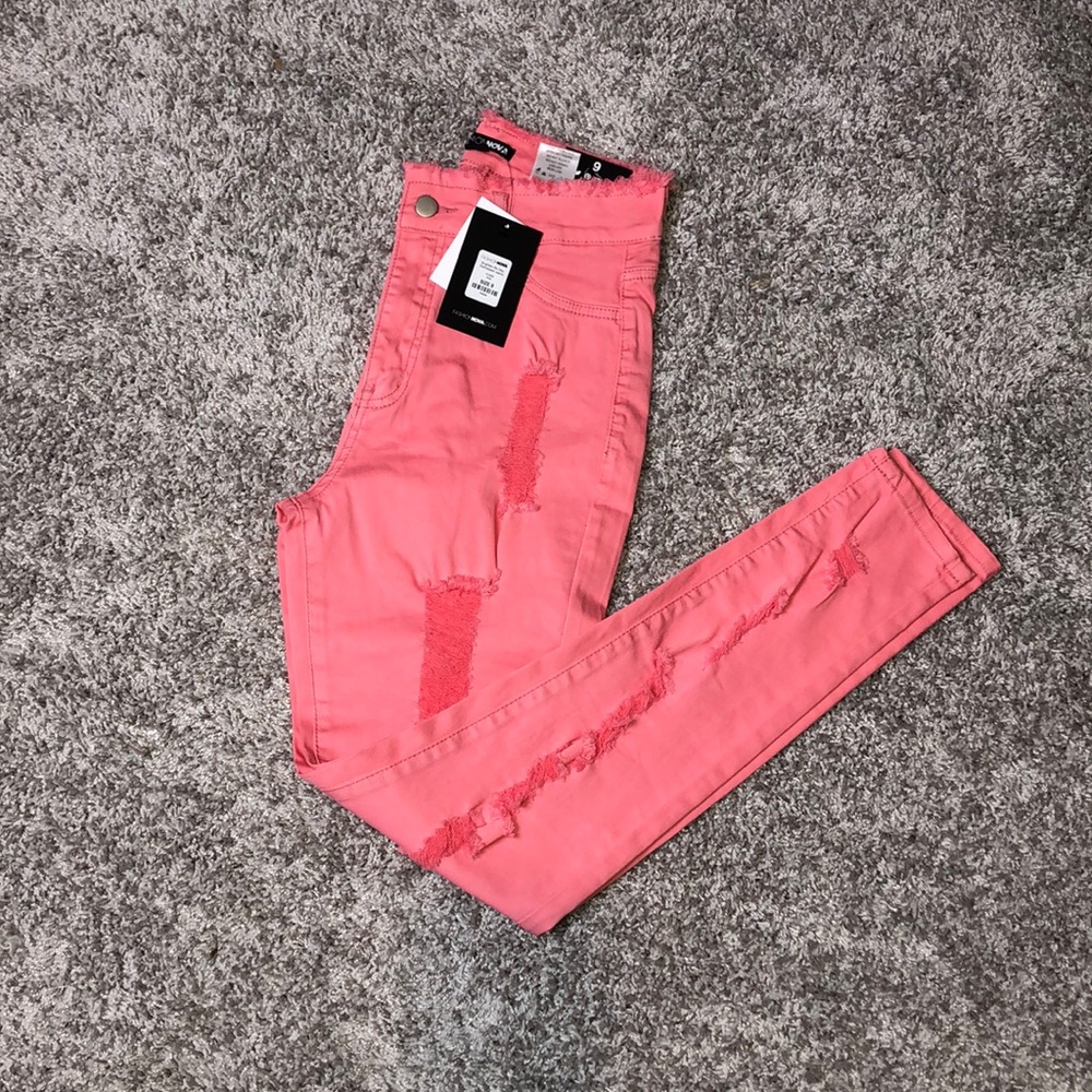Pink distressed jeans